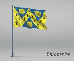 acenando a bandeira de shropshire - condado da inglaterra no mastro da bandeira. templo vetor