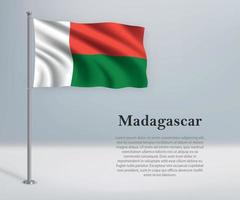 acenando a bandeira de madagascar no mastro. modelo de independência vetor