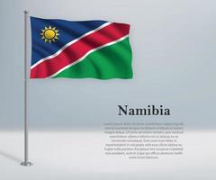 acenando a bandeira da namíbia no mastro. modelo para independência da vetor