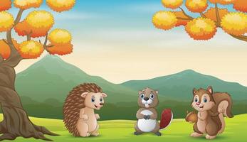 desenhos animados de animais felizes na paisagem de outono