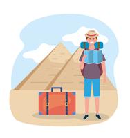 Homem de turista com mapa na frente de pirâmides egípcias vetor