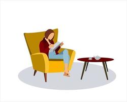 uma garota sentada em uma cadeira com um livro. uma mulher feliz lendo um livro, uma mesa com uma xícara e um bule.