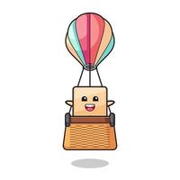 mascote de caixa de pizza montando um balão de ar quente vetor
