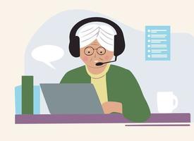 mulher idosa em seu laptop com fones de ouvido trabalhando online em casa. comunicação pela internet vetor