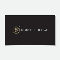 design de logotipo de folha de ouro de beleza vetor