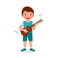 feliz menino bonitinho tocando ukulele cantando segurando guitarra com expressão facial sorridente vetor