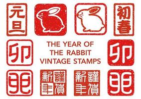 o ano do selo de saudação de ano novo japonês de coelho conjunto isolado em um fundo branco. tradução de texto - feliz ano novo. dia de Ano Novo. o Coelho. vetor