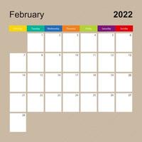 página do calendário para fevereiro de 2022, planejador de parede com design colorido. semana começa na segunda-feira. vetor