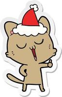 desenho de adesivo de um gato cantando usando chapéu de papai noel vetor