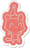 adesivo de desenho animado de um gato feliz usando chapéu de papai noel vetor