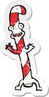adesivo retrô angustiado de um desenho animado dançando o bastão de doces de natal vetor