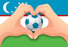 bola de futebol do uzbequistão e forma de coração de mão