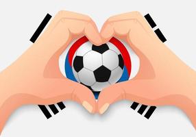 bola de futebol da coreia do sul e forma de coração de mão vetor