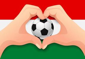 bola de futebol da Hungria e forma de coração de mão vetor