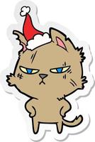desenho de adesivo duro de um gato usando chapéu de papai noel vetor