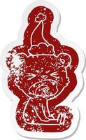 adesivo angustiado de desenho animado com raiva de um urso usando chapéu de papai noel vetor