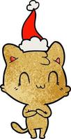 desenho texturizado de um gato feliz usando chapéu de papai noel vetor