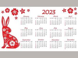 calendário 2023 com signo do zodíaco, ano do coelho, com arte de corte de papel vermelho sobre fundo de cor branca vetor