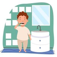 um menino europeu de cabelos cacheados com sardas de pijama está escovando os dentes no banheiro.