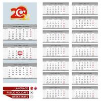 modelo de planejador de calendário de parede para o ano de 2022. língua turca e inglesa. semana começa a partir de segunda-feira. vetor