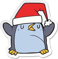 adesivo de um pinguim de desenho animado usando chapéu de natal vetor