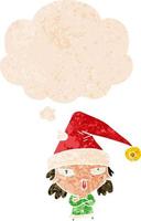garota de desenho animado usando chapéu de natal e balão de pensamento em estilo retrô texturizado vetor