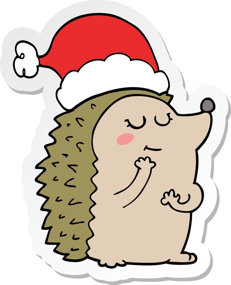 adesivo di un riccio cartone animato che indossa il cappello di Natale vettore