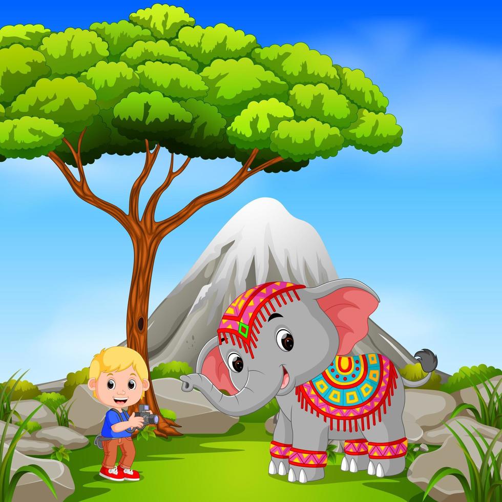 elefante e fotografo in posa con scena di montagna vettore