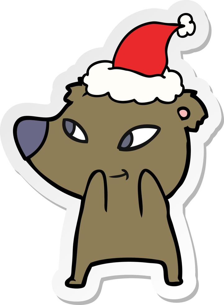 simpatico cartone animato adesivo di un orso che indossa il cappello di Babbo Natale vettore