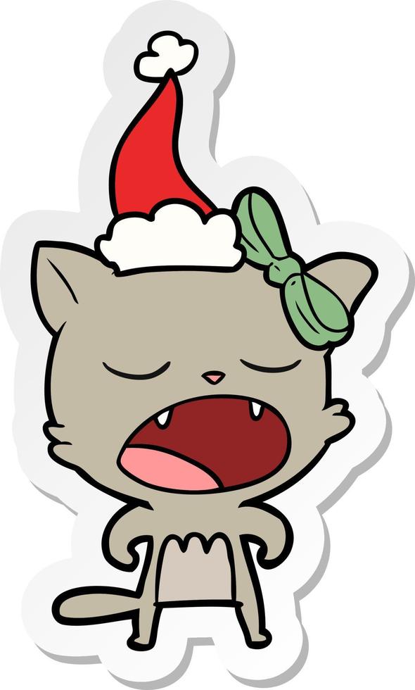 adesivo cartone animato di un gatto che miagola indossando il cappello di Babbo Natale vettore