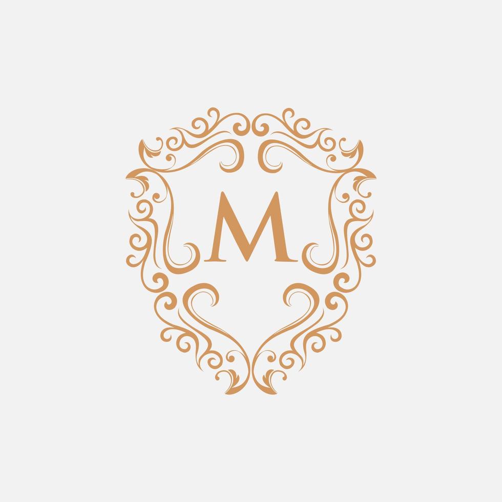 lettera m scudo lusso ornato monogramma logo vettore