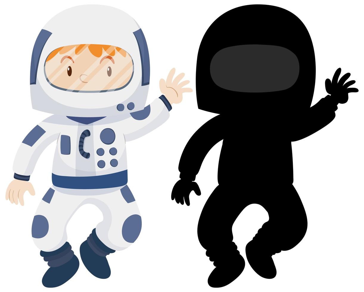 bambino che indossa il costume da astronauta con la sua silhouette vettore