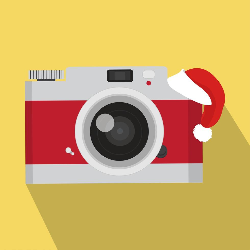 macchina fotografica vintage rossa con cappello da Babbo Natale vettore