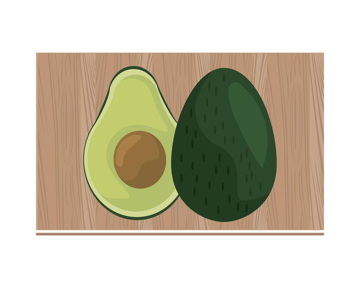 mezzo avocado sul bordo della cucina in legno vettore