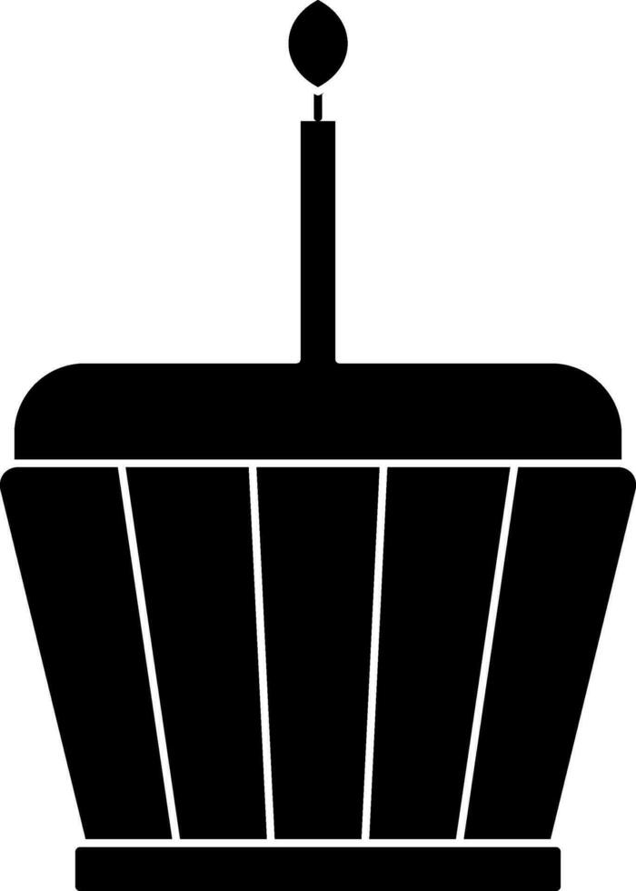 nero e bianca Cupcake con ardente candela. glifo icona o simbolo. vettore