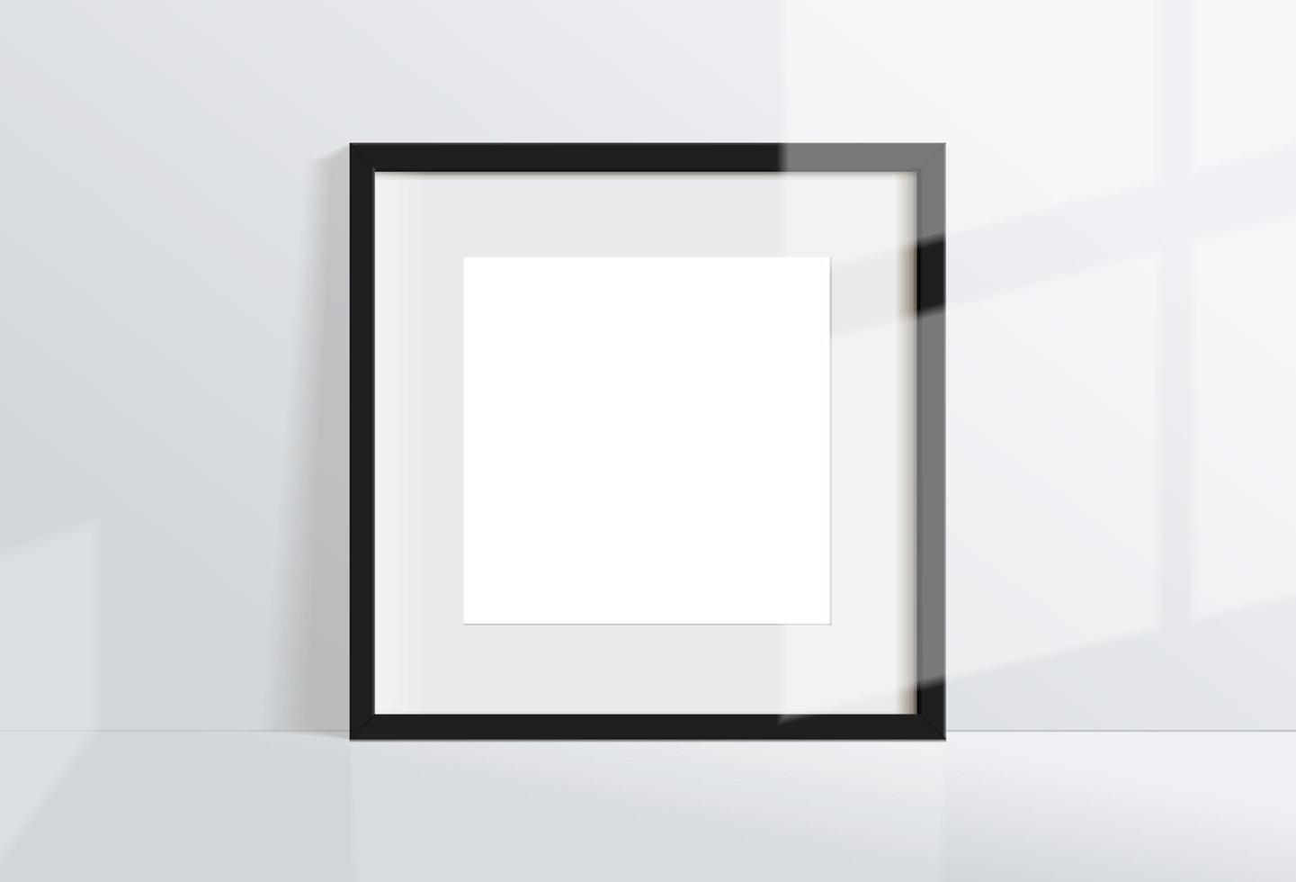 immagine di cornice nera quadrata vuota minima finta appesa sullo sfondo del muro bianco vettore