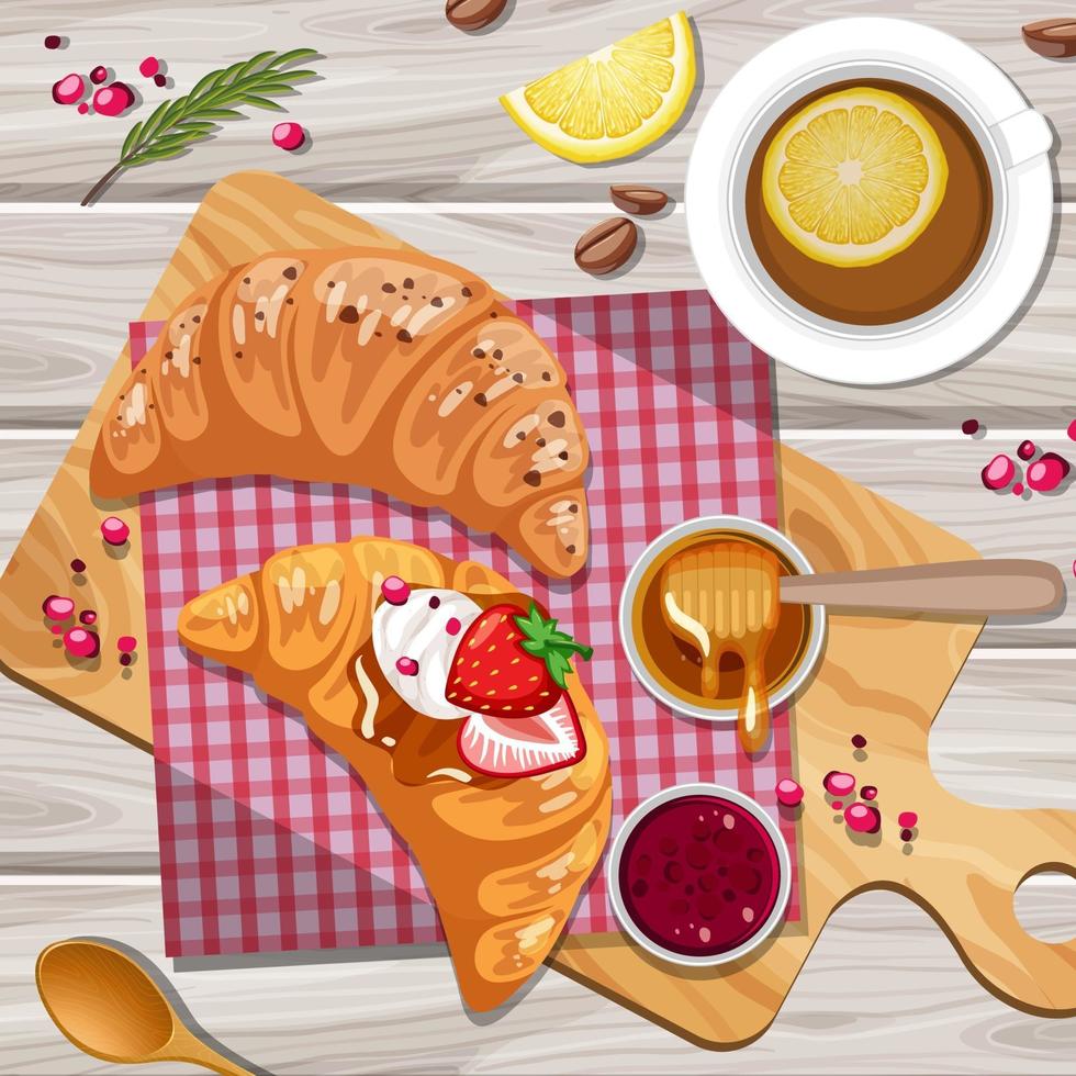 croissant per la colazione con una tazza di tè al limone sullo sfondo del tavolo vettore