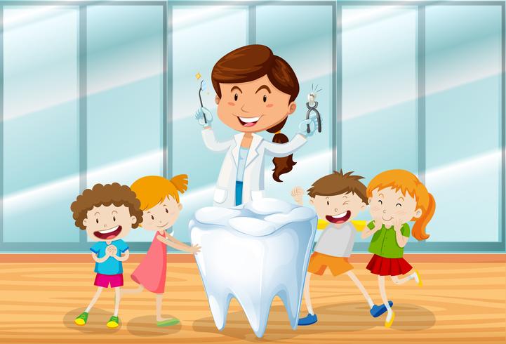 Dentista e bambini felici vettore