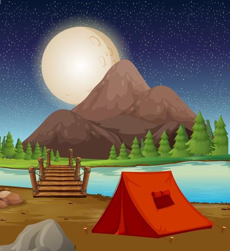 Campeggio con tenda vicino al fiume di notte vettore