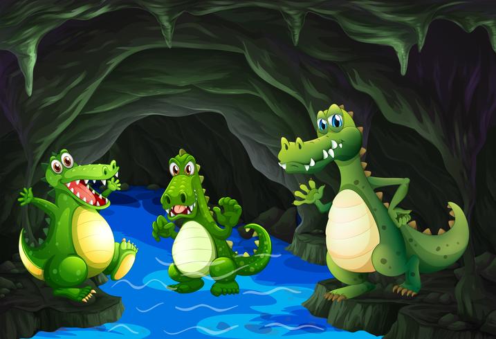 Tre coccodrilli vivono nella grotta vettore