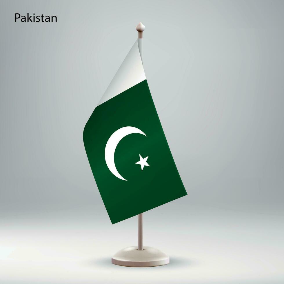 bandiera di Pakistan sospeso su un' bandiera In piedi. vettore