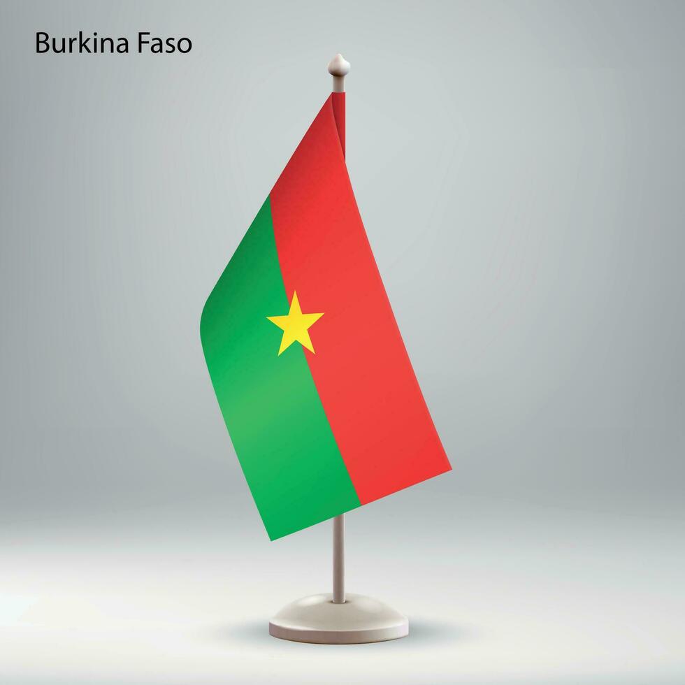 bandiera di burkina faso sospeso su un' bandiera In piedi. vettore