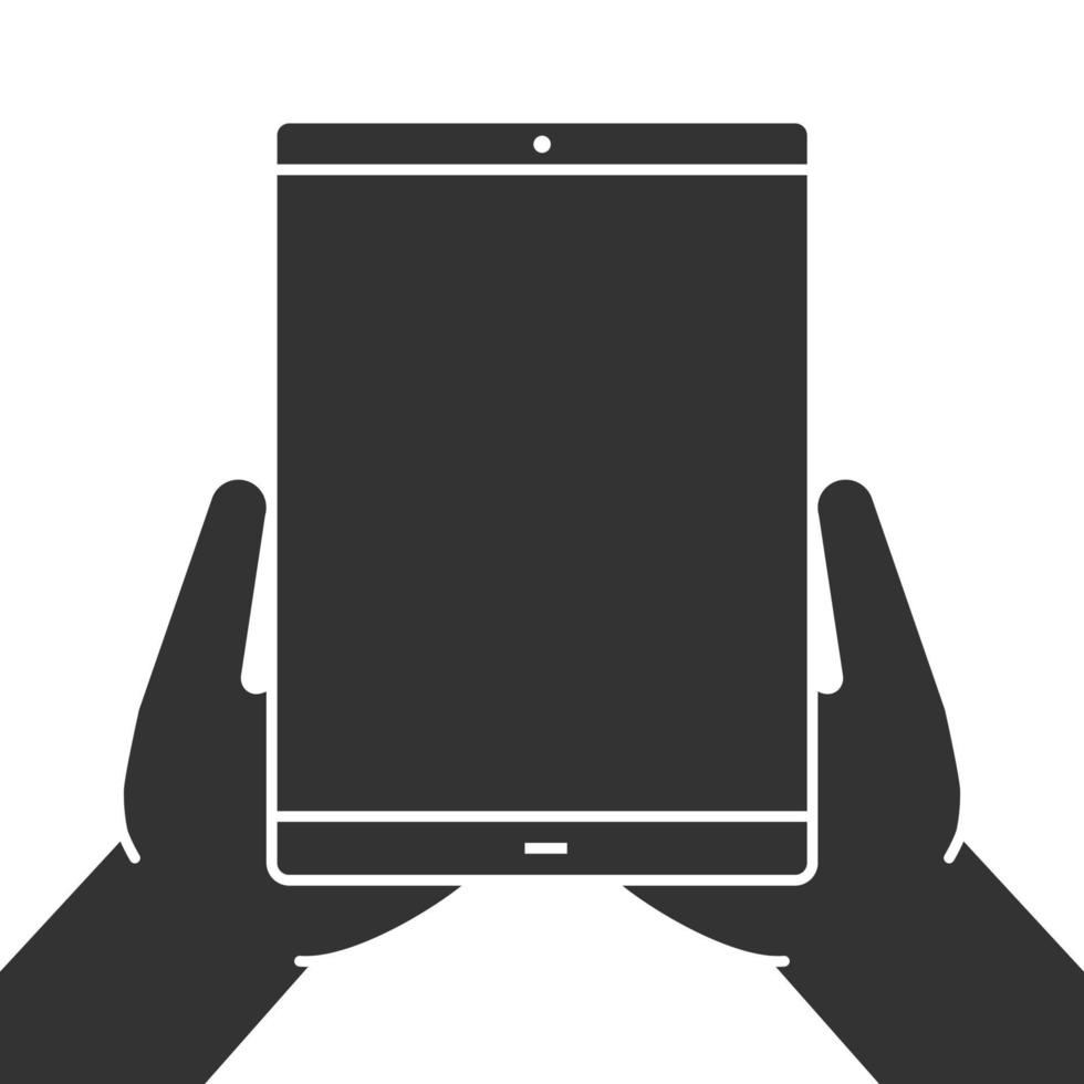 mani che tengono l'icona del glifo del computer tablet. simbolo di sagoma. spazio negativo. illustrazione vettoriale isolato