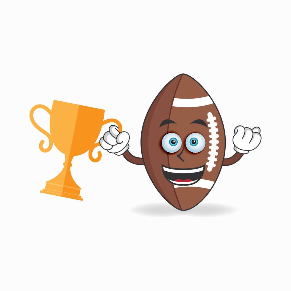 personaggio della mascotte del football americano con un trofeo nella mano destra. illustrazione vettoriale