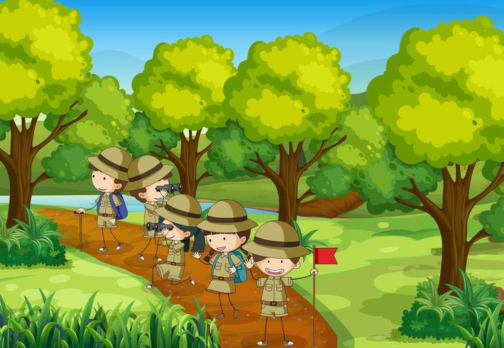 Scena con bambini che esplorano la foresta vettore