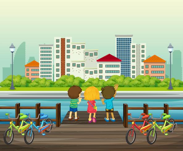 I bambini affittano la bicicletta nel parco vettore