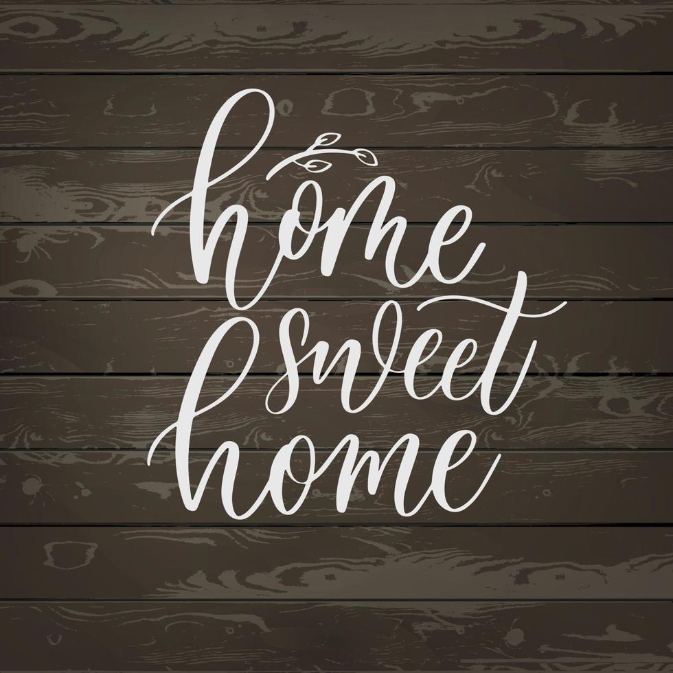 casa dolce casa - scritte a mano iscrizione su uno sfondo di legno. vettore