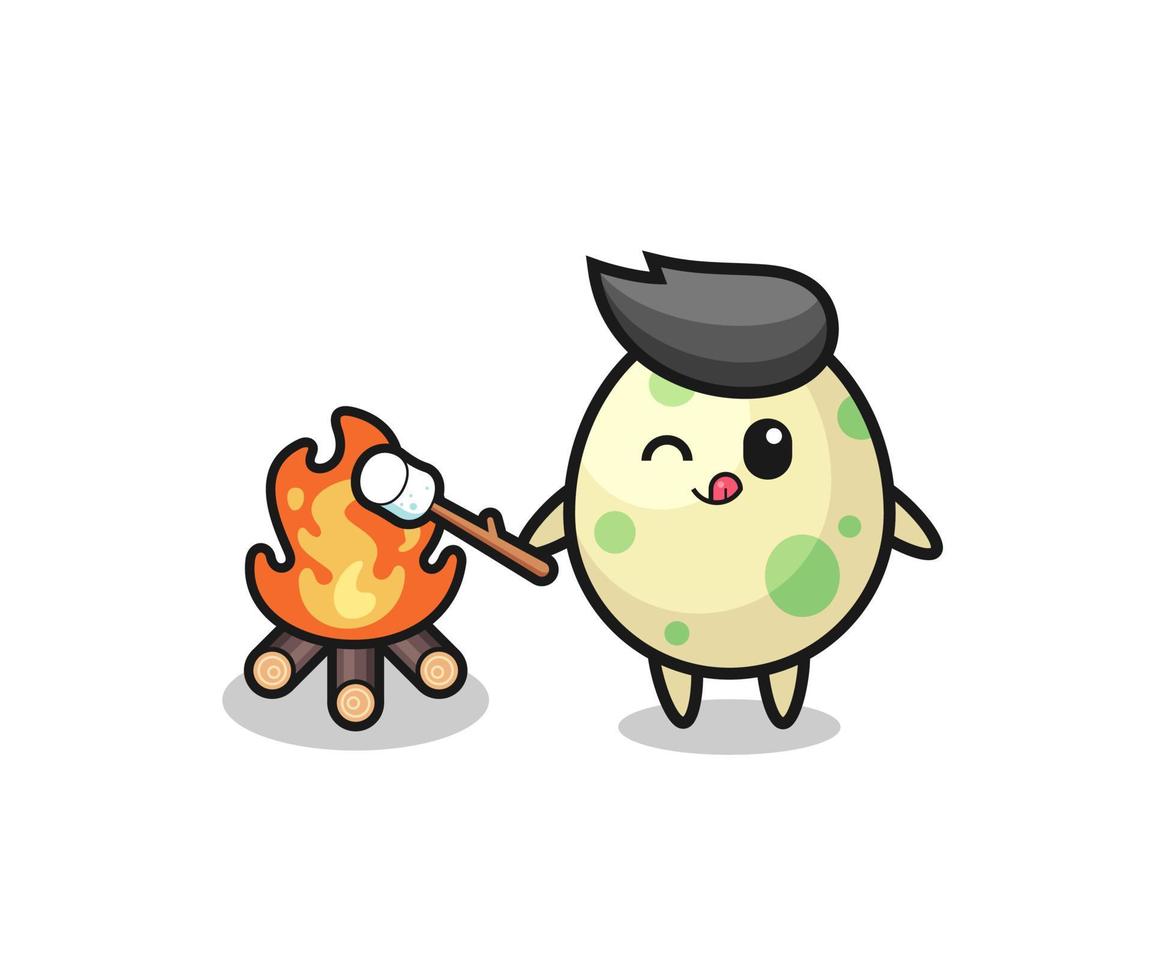 il personaggio dell'uovo maculato sta bruciando marshmallow vettore