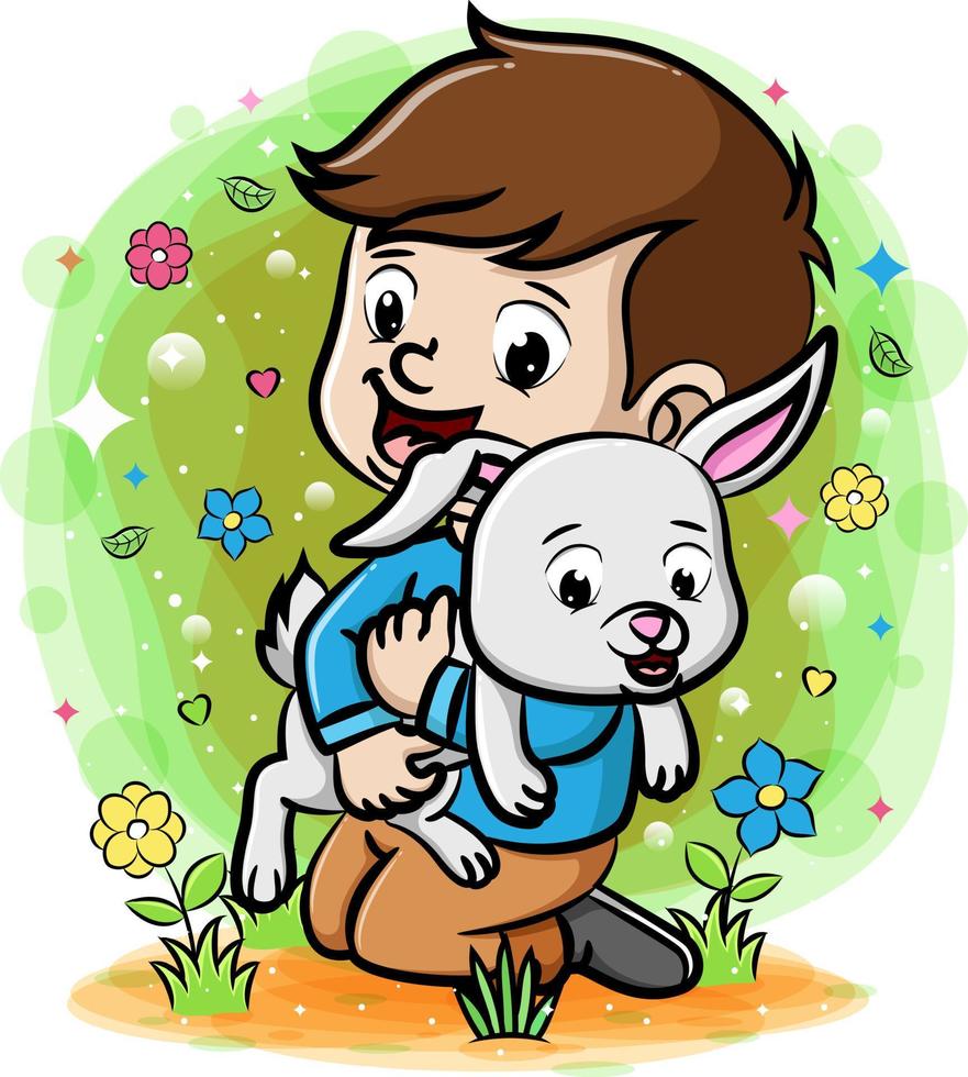 un ragazzo che gioca con il coniglio in giardino vettore