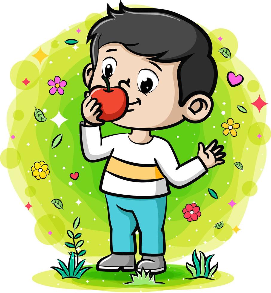 un ragazzo carino che mangia una mela in giardino vettore